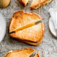 Air Fryer Grilled Cheese, cut in half to show the cheese melting out.